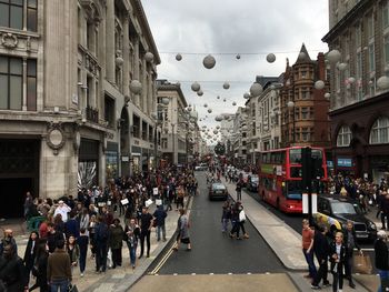 People walking on street in city