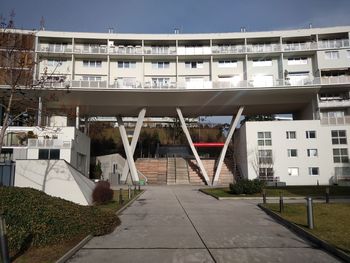 View of swimming pool by buildings in city
