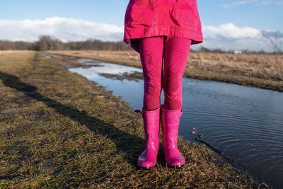 Low section of woman standing on ground