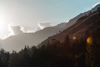 Scenic view of silhouette mountains against sky
