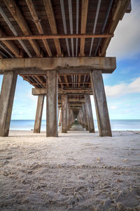 View of pier over sea against sky