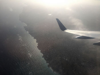 Cropped image of airplane wing