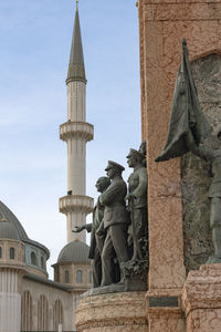 Low angle view of statue against sky