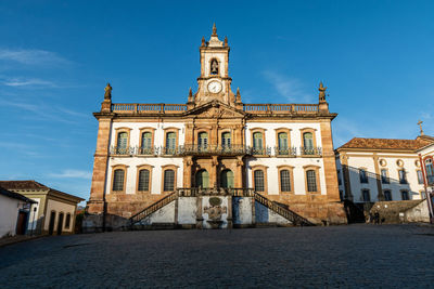 Facade of historic building against blue sky