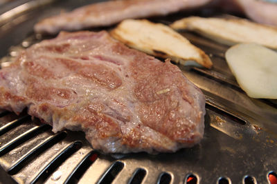 Korean grilled pork bbq or samgyeopsal-gui with charcoal at korean restaurant, busan, south korea