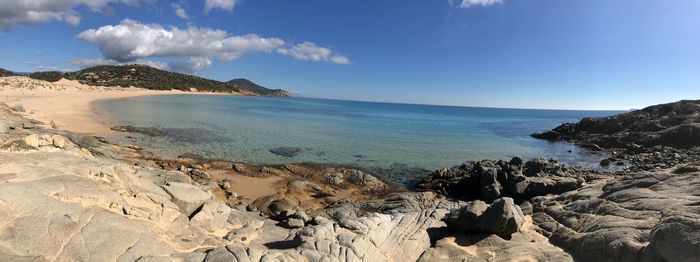 Panoramic view of sea against blue sky