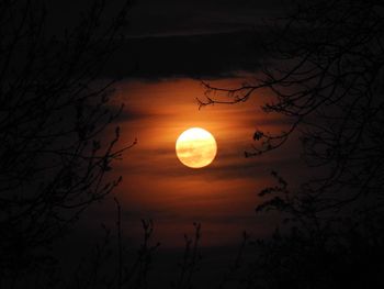 Scenic view of moon in sky at sunset