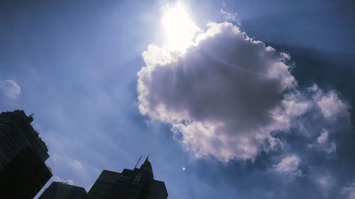 Low angle view of buildings against blue sky