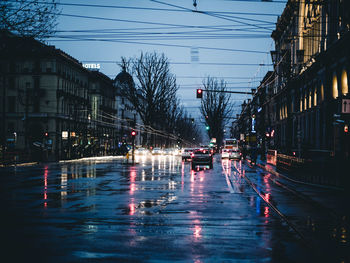 View of wet street in city