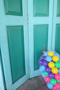 Close-up of multi colored balloons door