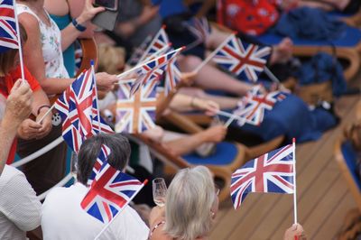 High angle view of people with british flags in city