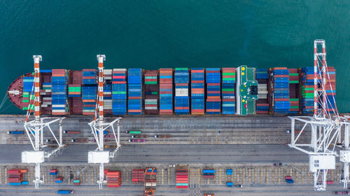 Aerial view container ship working at seaport, global business company import export logistic