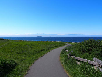 Empty road along landscape