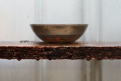 Close-up of rusty metal on table
