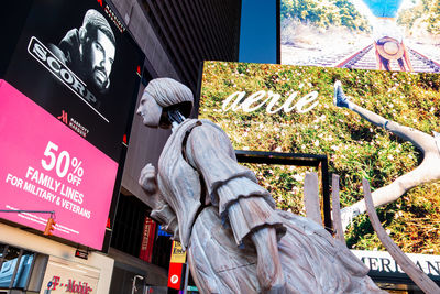 Low angle view of statue against building