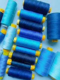 Directly above shot of blue thread spools