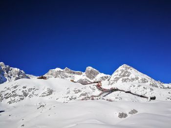 Scenic view of snowcapped mountains against clear blue sky
jade dragon snow mountain