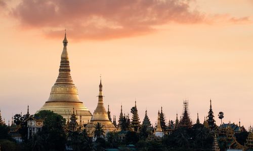 Low angle view of temple against sky during sunset