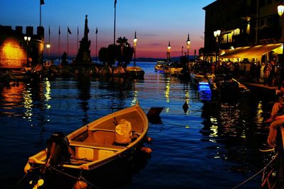 Panoramic view of boats in sea at night