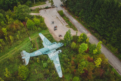 High angle view of abandoned airplane on field