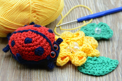 Close-up of woolen craft products on table