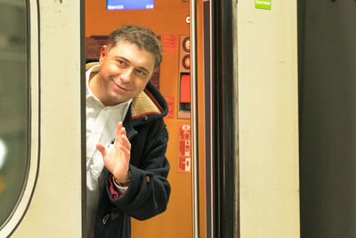 Full length of man standing in corridor