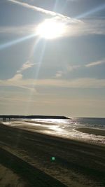 Scenic view of beach against sky during sunset