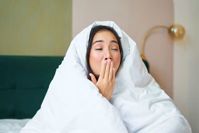 Portrait of young woman with eyes closed