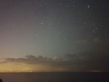 Scenic view of sea against sky at night