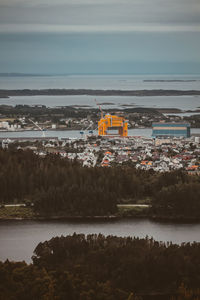 Scenic view of sea and buildings against sky