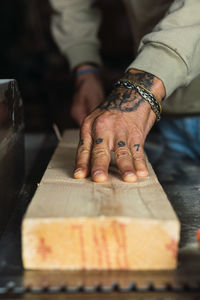 Midsection of woman working on table