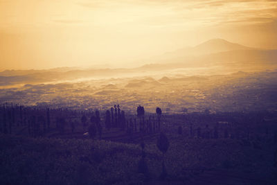 Scenic view of landscape against sky during sunset