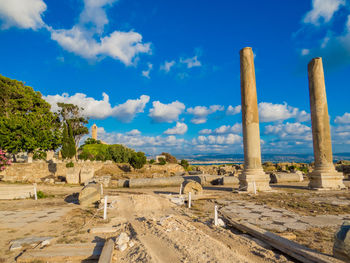 Ruins of historical building against blue sky