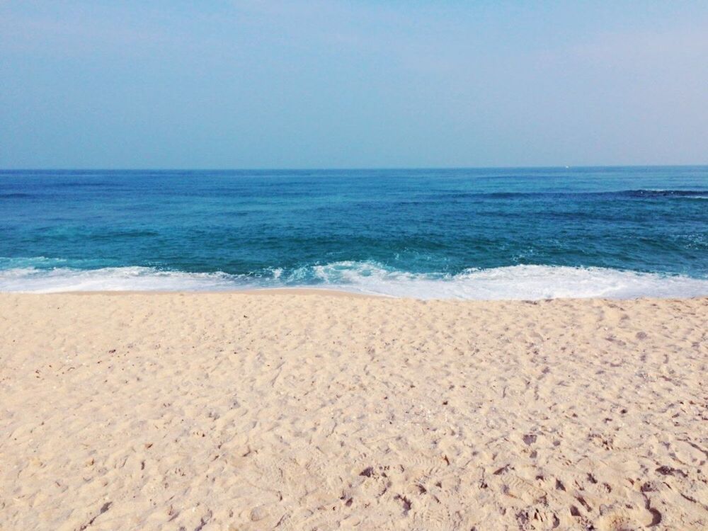 sea, horizon over water, beach, water, clear sky, sand, shore, tranquil scene, copy space, scenics, tranquility, beauty in nature, nature, wave, blue, idyllic, surf, remote, coastline, day