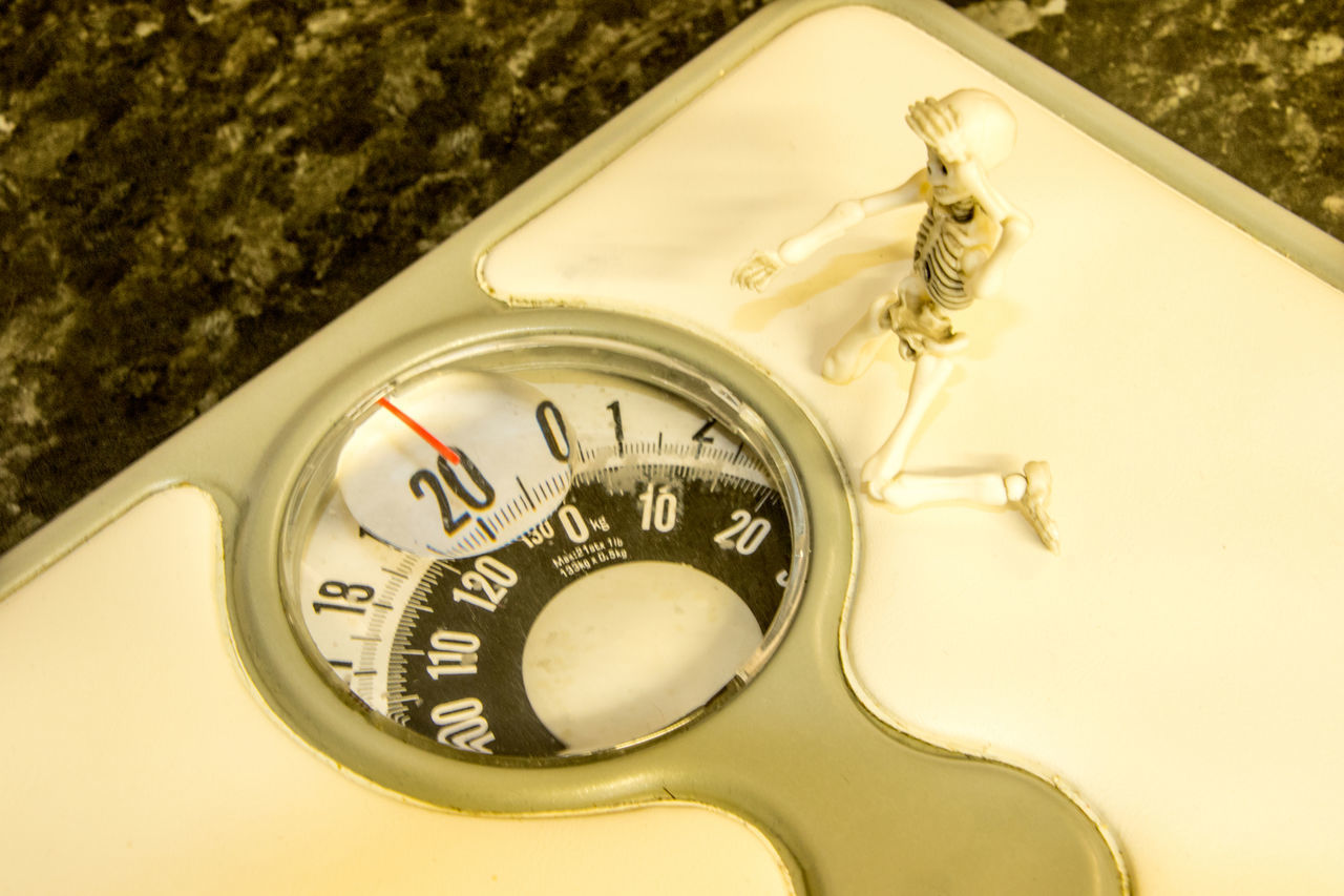 CLOSE-UP OF CLOCK ON TABLE