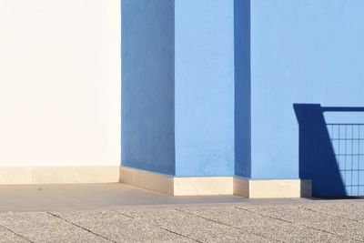 Shadow of building against clear blue sky