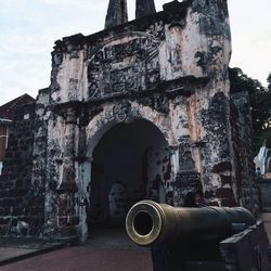 Low angle view of old ruin against sky