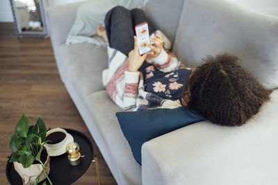 High angle view of woman using mobile phone