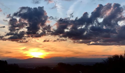 Scenic view of dramatic sky during sunset