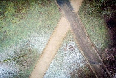 High angle view of man standing on dirt road