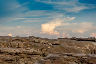 Rock formations on landscape against sky