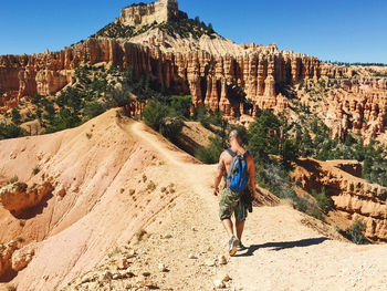 Full length of man walking in the canyon 