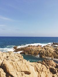 Scenic view of sea against clear blue sky