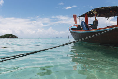 Boat sailing in sea against sky