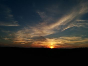 Silhouette of landscape against sunset