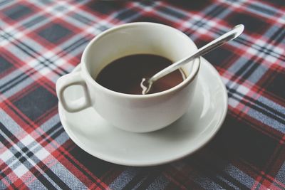 Close-up of coffee cup on table