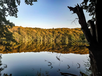 Scenic view of lake against sky during autumn
