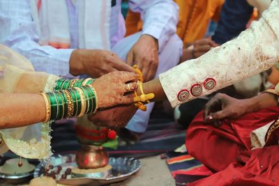 Midsection of people in temple