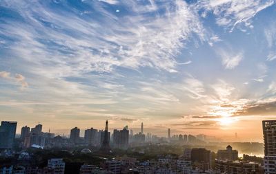 Cityscape against sky during sunset