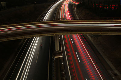 High angle view of light trails on highway at night